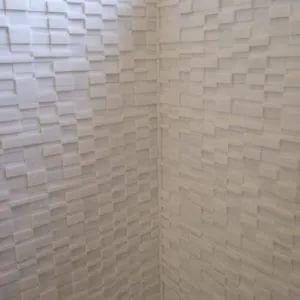 White textured 3D wall tile in a shower corner